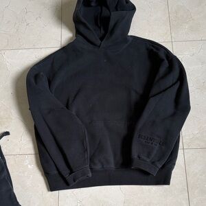 Essentials Black Men's Pullover Hoodie with Subtle Sleeve Logo